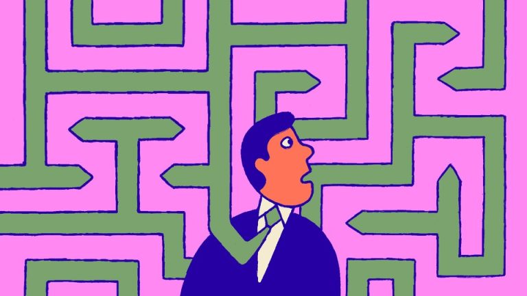 A man in a tie standing in the middle of a maze