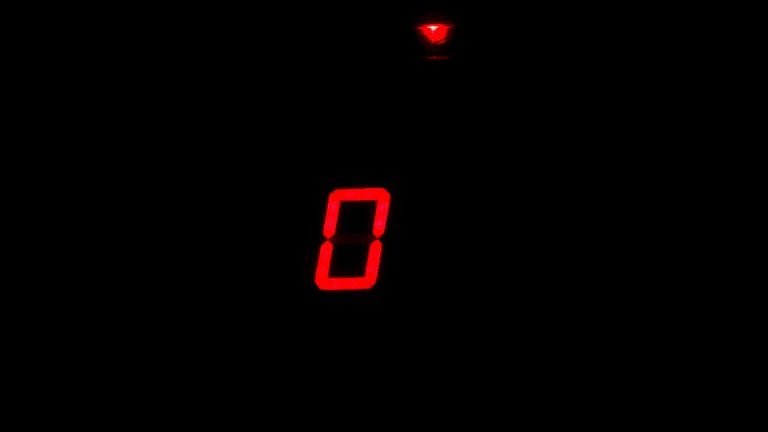 A red zero against a black background