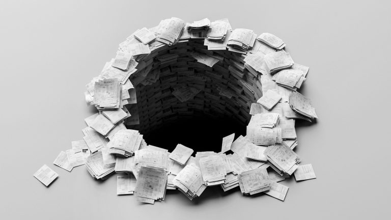 A black-and-white photo-illustration of sets of white paper packets, resembling printed research papers, stacked in a circle with a hole in the center plummeting into darkness.