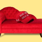 A red MAGA cap atop a red psychiatrist’s couch