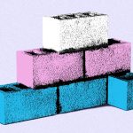 White, blue, and pink cement bricks stacked in a pyramid