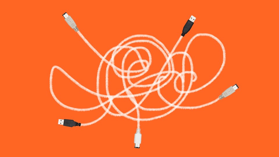 An illustration of a spaghetti of computer cables with different connectors