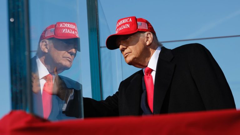 Donald Trump and his reflection on protective glass