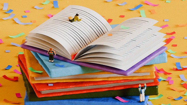 Figurines on top of a stack of books