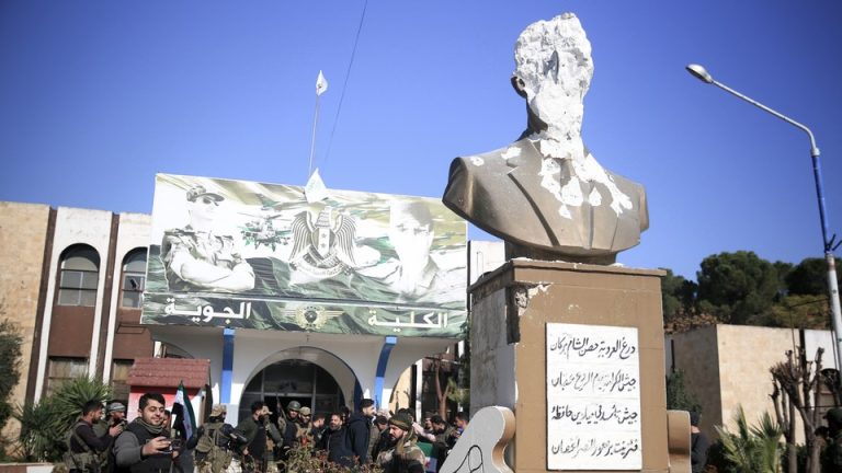 A defaced bust of Hafez al-Assad