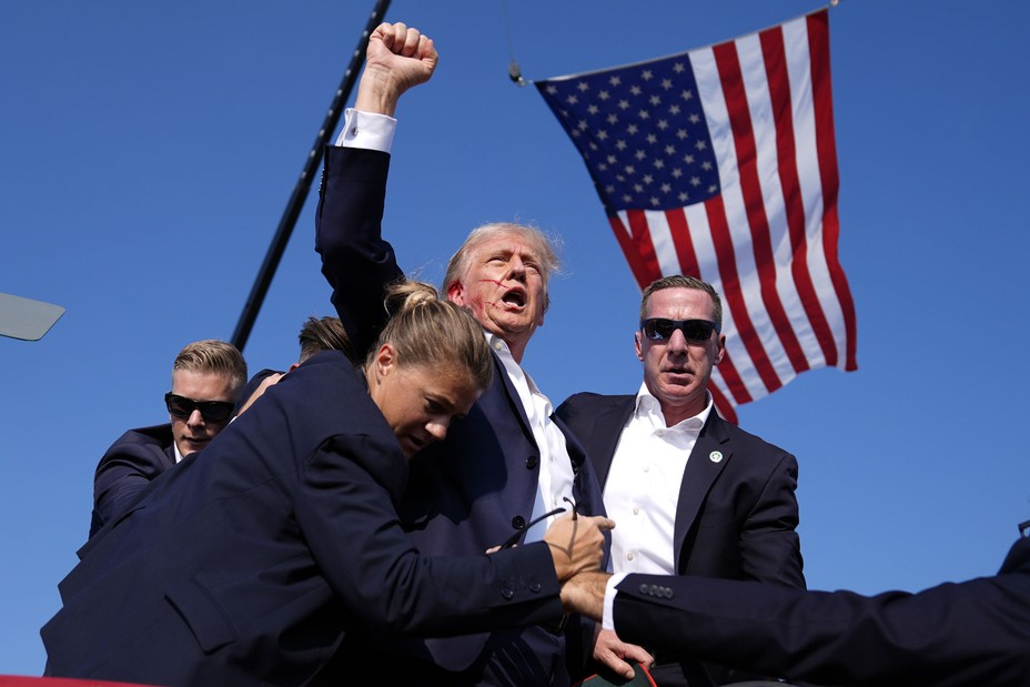 The Republican presidential candidate, former President Donald Trump, is surrounded by U.S. Secret Service agents after an attempted assassination at a campaign rally on July 13, 2024, in Butler, Pennsylvania. #