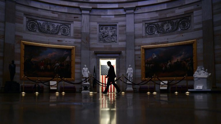 A person walks through the Capitol building