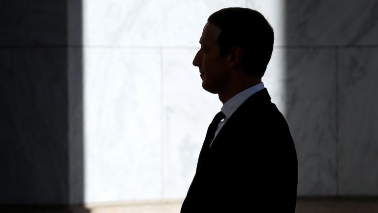 The silhouette of Mark Zuckerberg in a suit