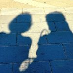 Shadow of two women talking