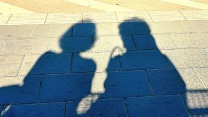 Shadow of two women talking