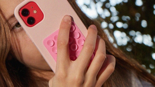 A photograph close up of a girl on her phone