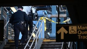 A police officer on a subway staircase