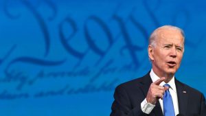 Photo of Joe Biden speaking with the backdrop of the U.S. Constitution