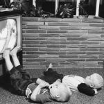 Two boys watching television