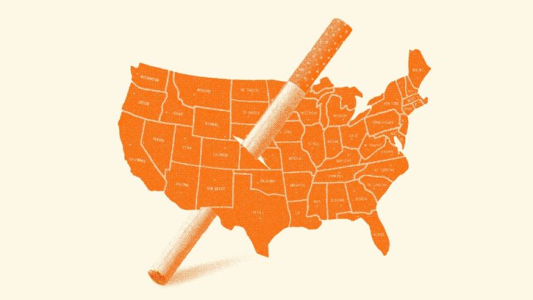 A cigarette punctures a hole through the middle of a map of the USA