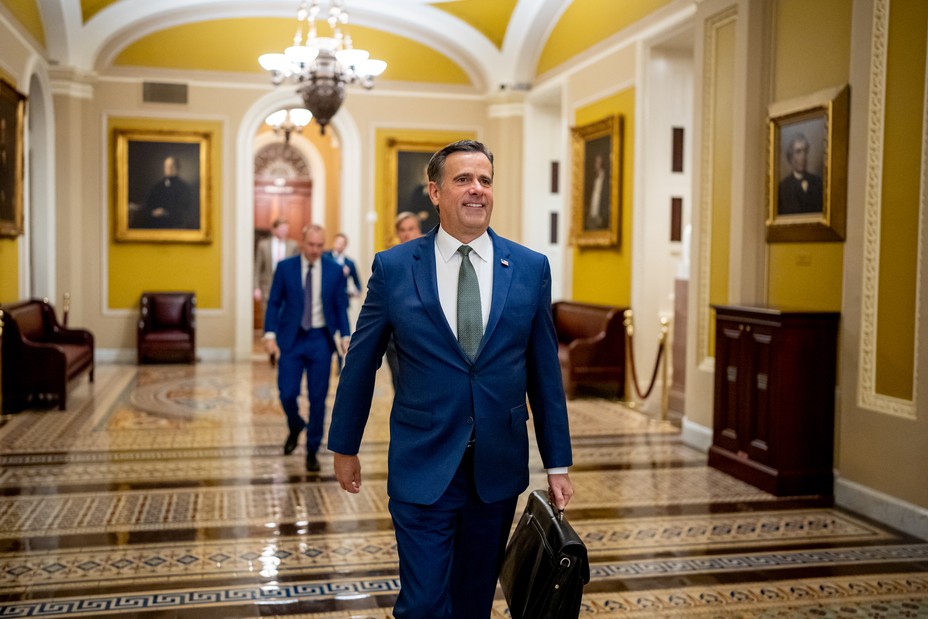 John Ratcliffe walks in the hallway on Capitol Hill